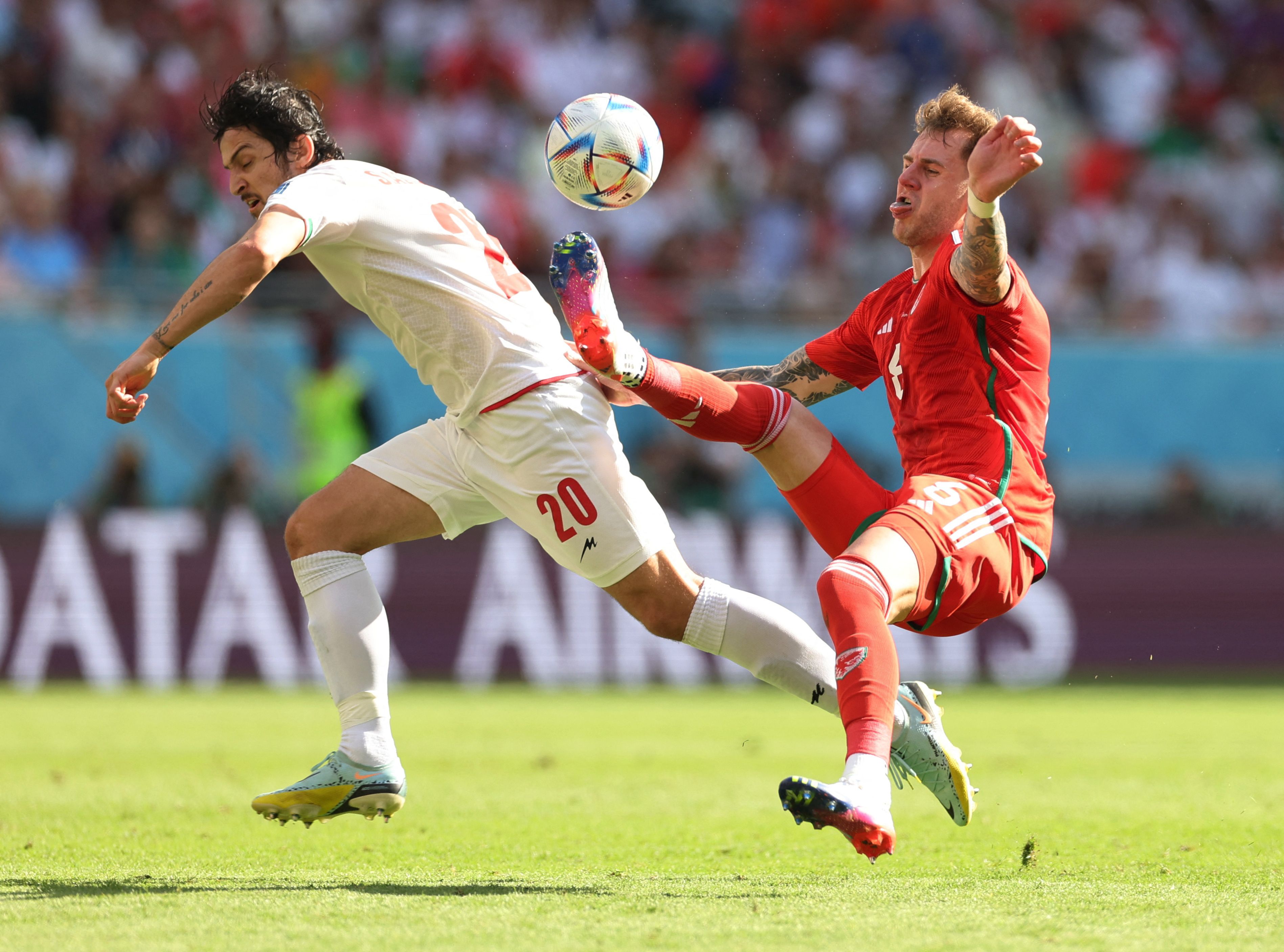 Group B - Wales v Iran - Ahmad Bin Ali Stadium, Al Rayyan, Qatar - November 25, 2022 Wales' Joe Rodon in action with Iran's Sardar Azmoun 