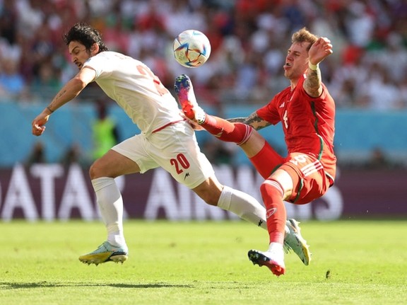 Group B - Wales v Iran - Ahmad Bin Ali Stadium, Al Rayyan, Qatar - November 25, 2022 Wales' Joe Rodon in action with Iran's Sardar Azmoun