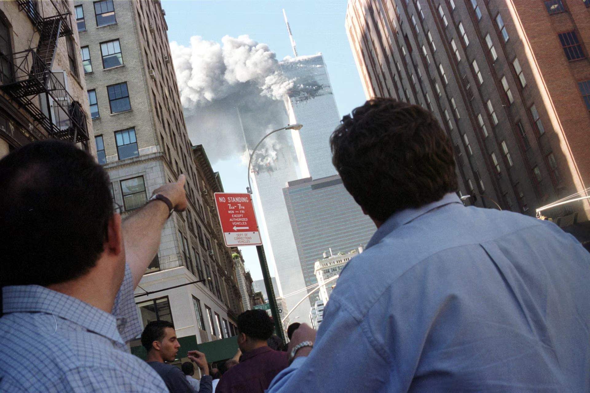 Pedestrians react to the World Trade Center collapse, September 11, 2001.