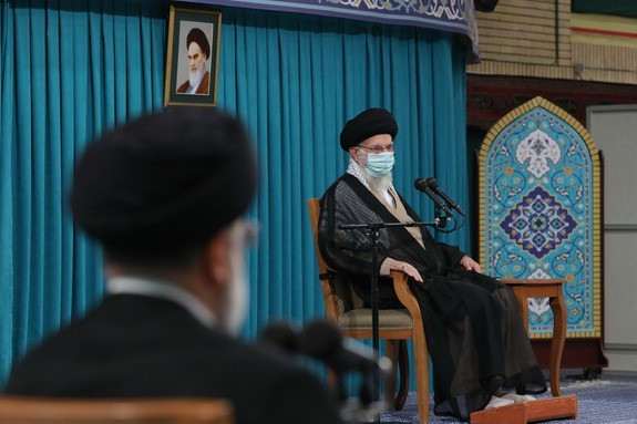 Iran's president Ebrahim Raisi listens as Supreme Leader Khamenei speaks. August 30, 2022