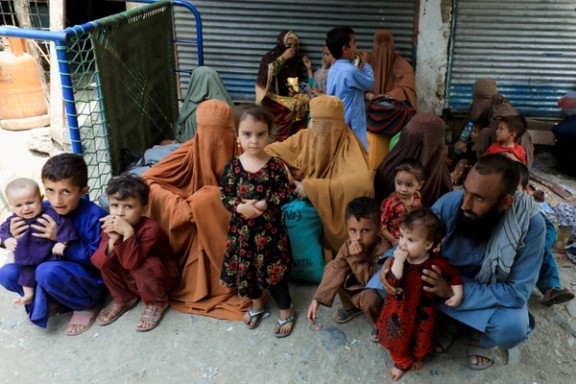 An Afghan family waiting to cross main Afghanistan-Pakistan land border crossing, in Torkham, Pakistan September 15, 2023