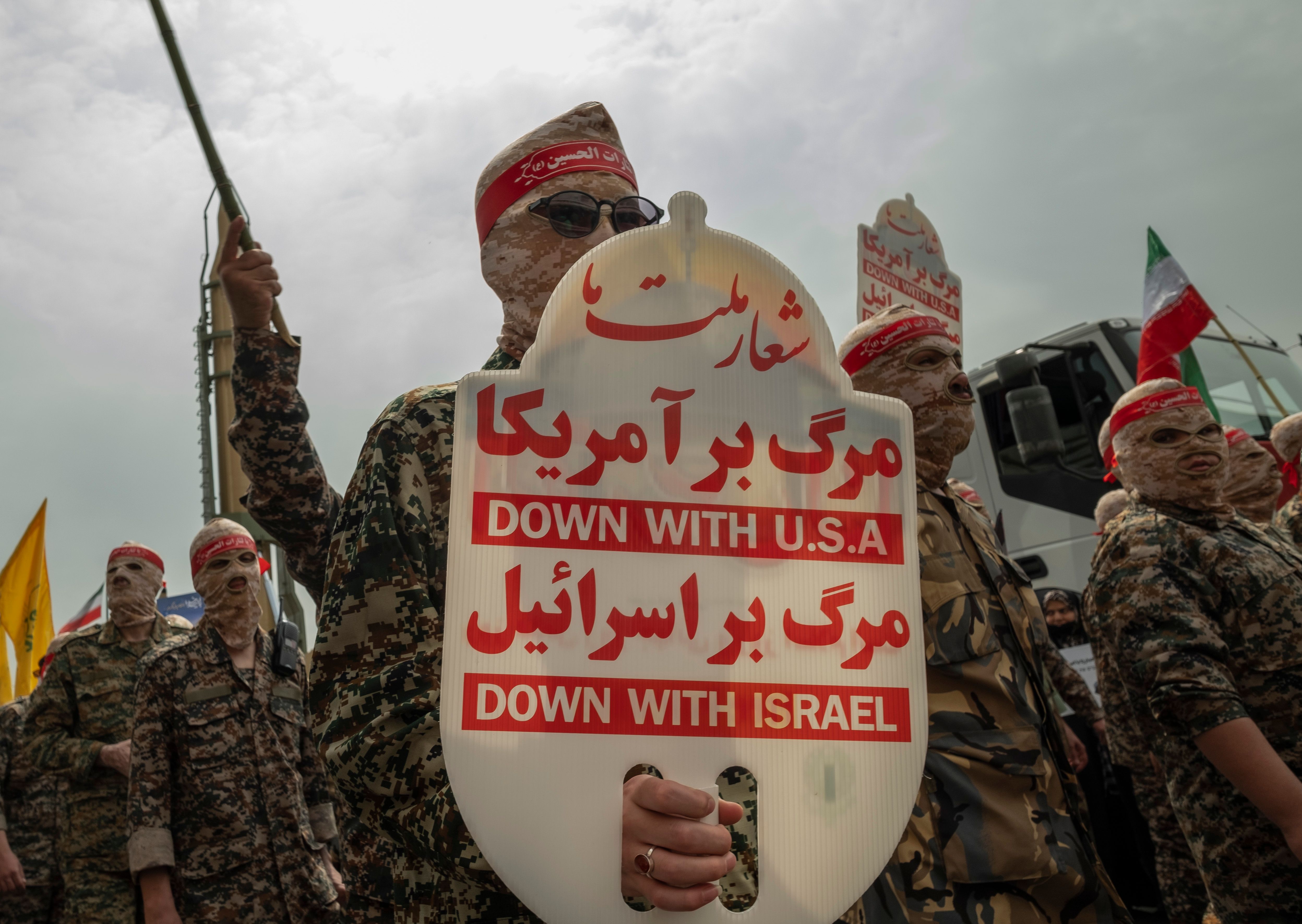 The slogans in this photo of Quds Day in Persian say 'Death to', not 'Down with'. 
