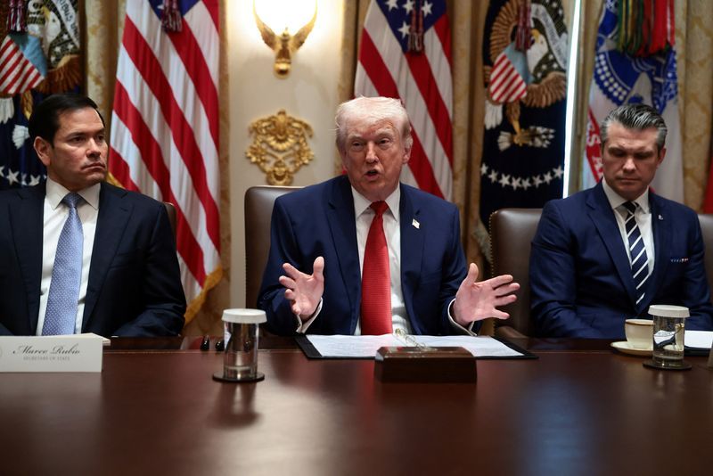 US President Donald Trump, sitting next to Secretary of State Marco Rubio and Defense Secretary Pete Hegseth, speaks during a cabinet meeting at the White House, March 26, 2026. 