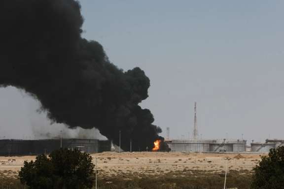 Smoke billows from a Saudi Aramco's petroleum storage facility after an attack in Jeddah, March 26, 2022.