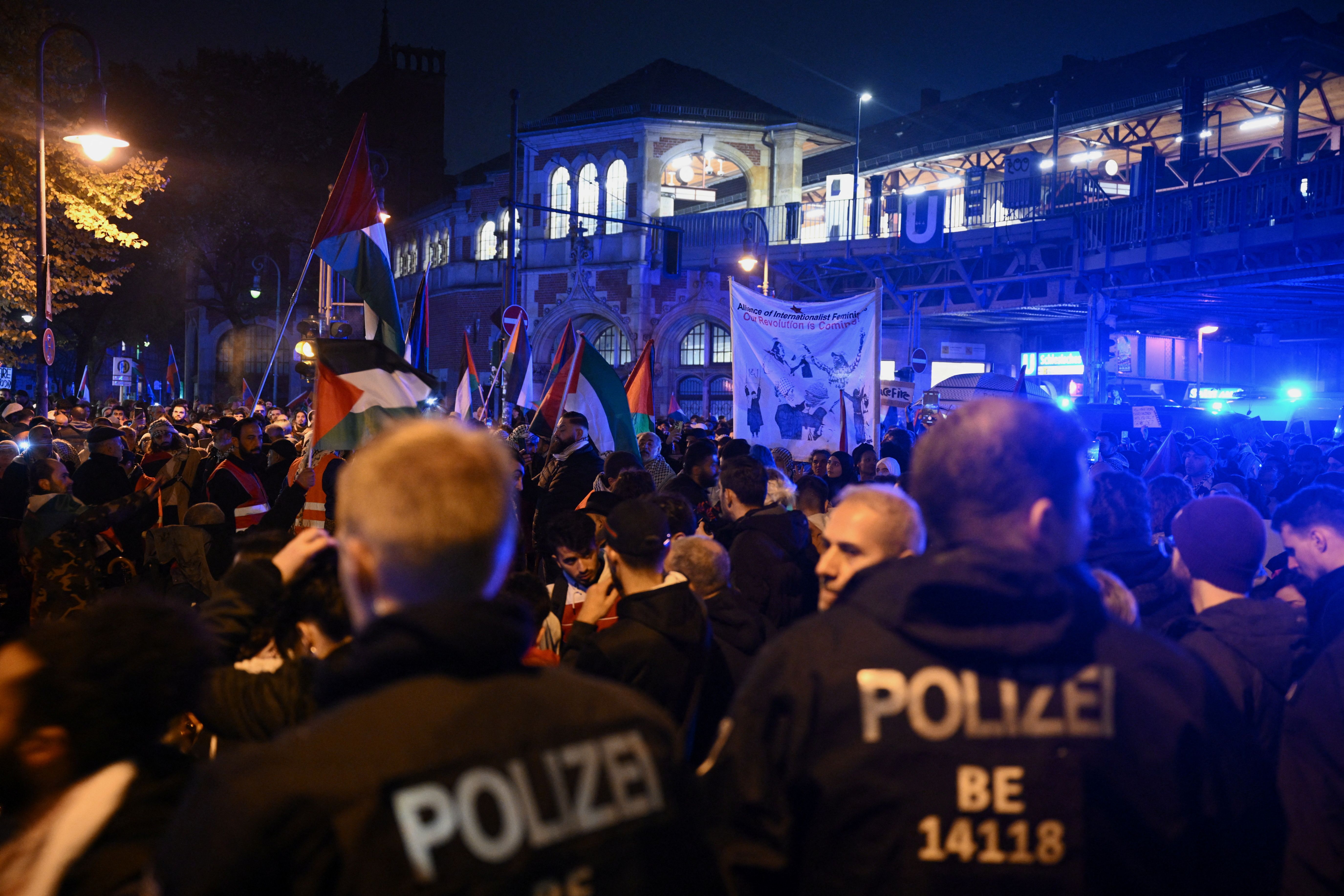 Police officers stand guard as people attend a pro-Palestinian demonstration, in Berlin, Germany October 28, 2023. 
