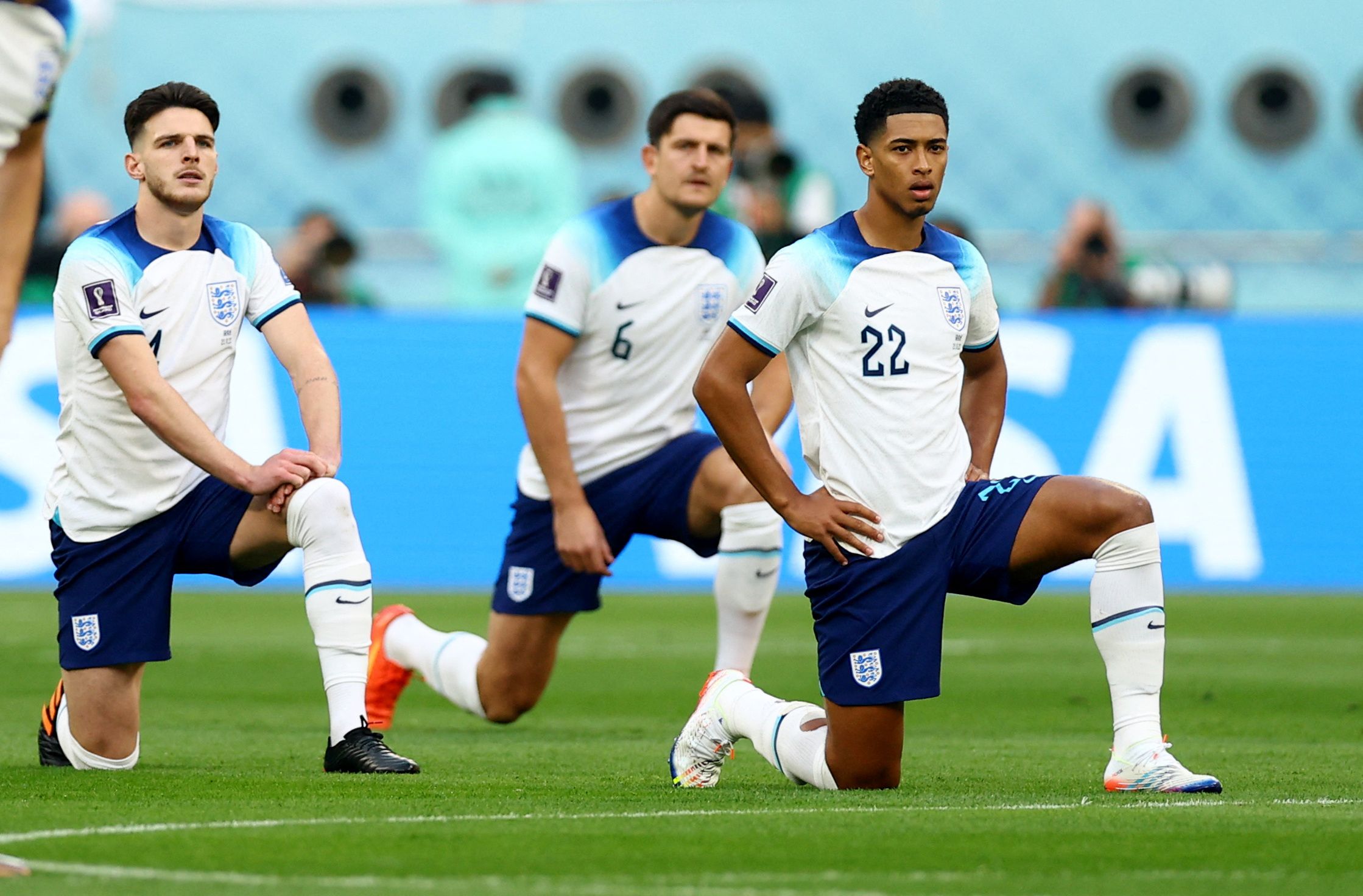 England's Jude Bellingham and Declan Rice take the knee before the match against Iran.