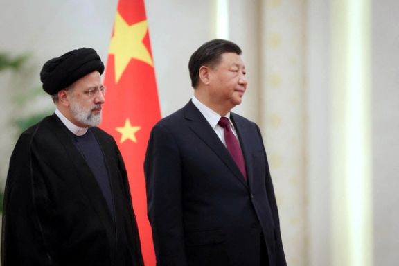 Iranian President Ebrahim Raisi stands next to Chinese President Xi Jinping during a welcoming ceremony in Beijing, China, February 14, 2023.