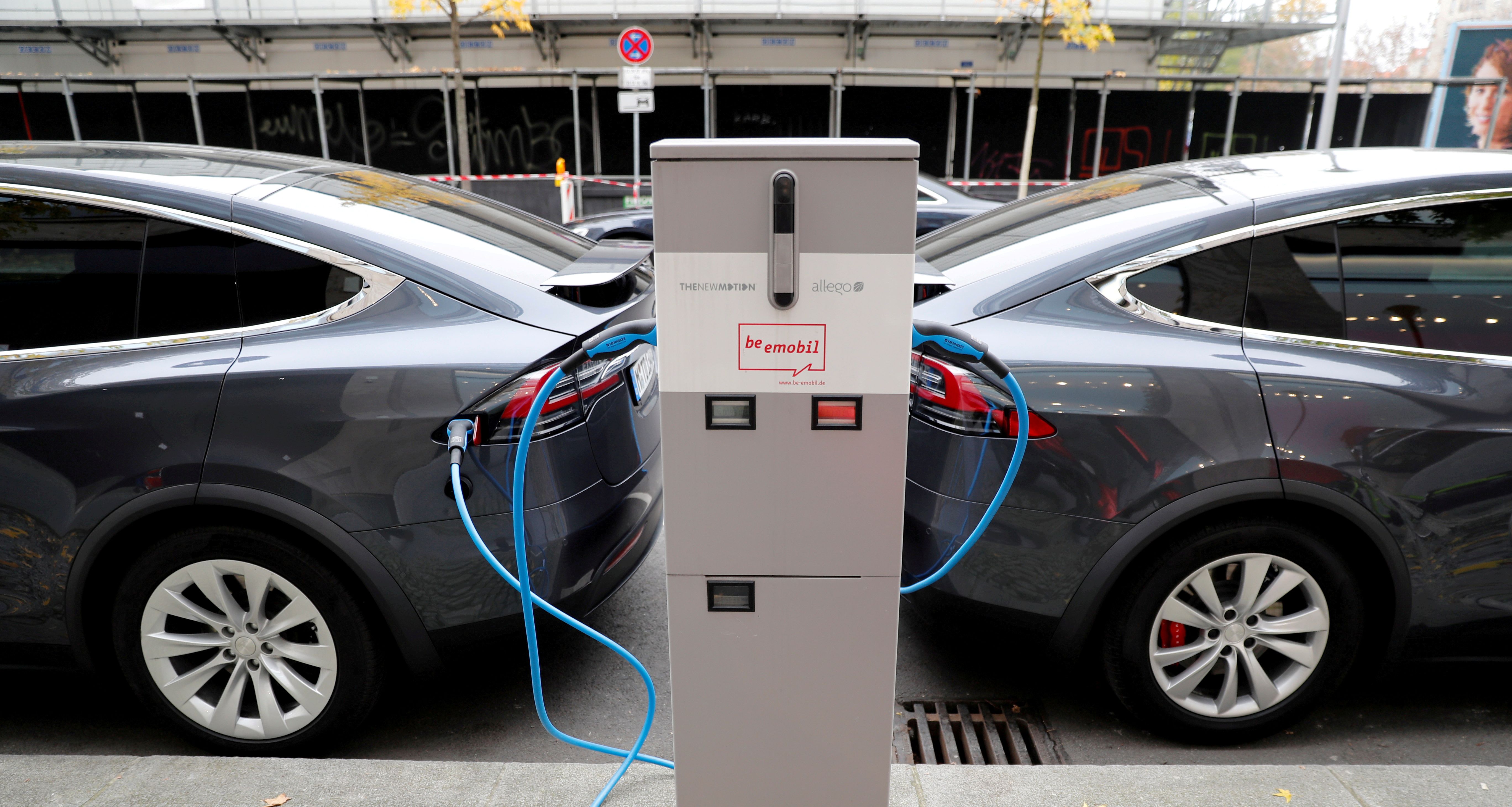 Tesla Model X electric cars recharge their batteries in Berlin, Germany, November 13, 2019.
