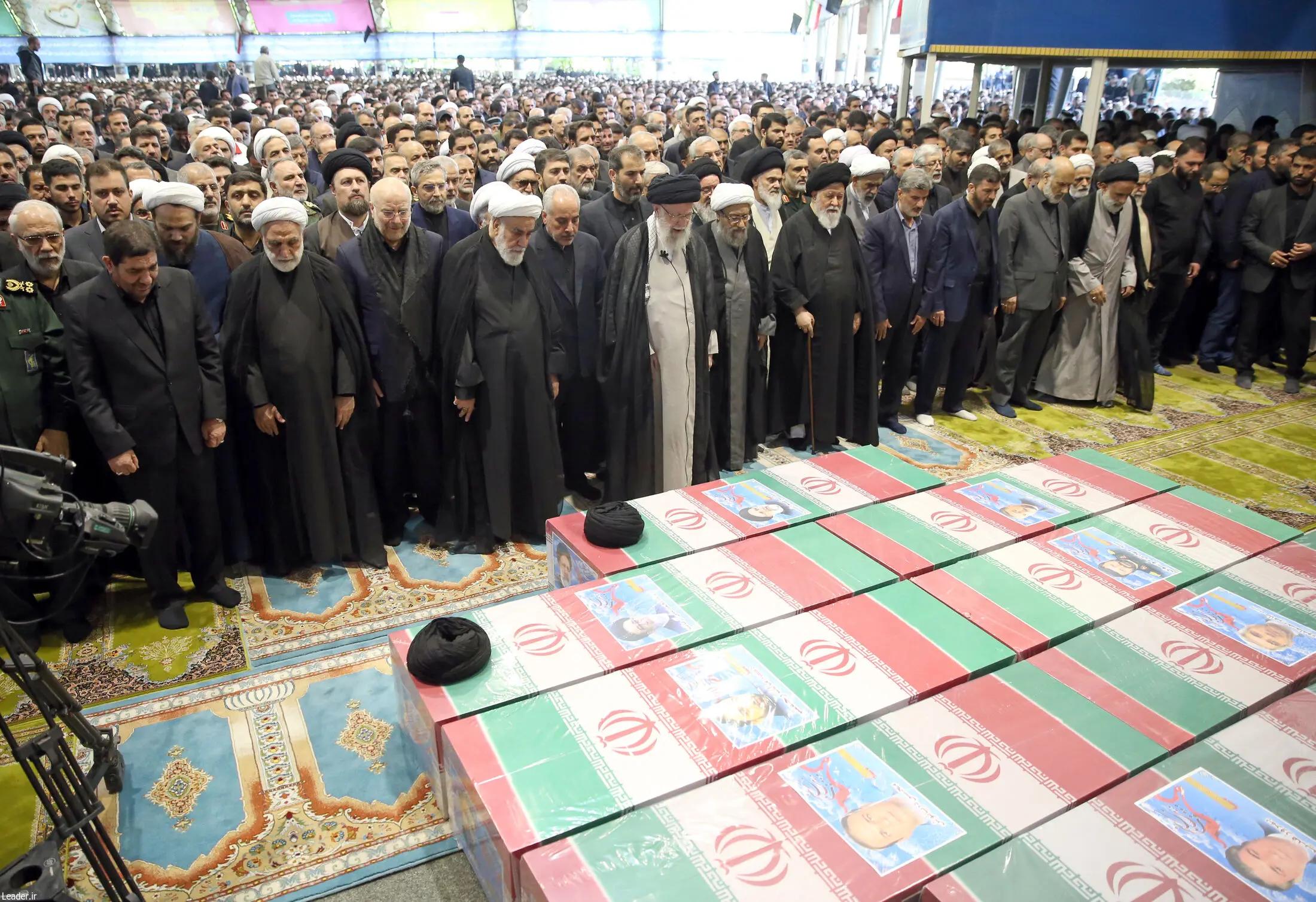 Former Supreme Leader Ali Khamenei leading the funeral prayer at the coffin of Ebrahim Raisi and other officials killed in the crash  