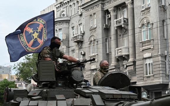 Fighters of Wagner private mercenary group are seen atop of a tank while being deployed near the headquarters of the Southern Military District in the city of Rostov-on-Don, Russia, June 24.