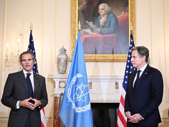 US Secretary of State Antony Blinken (R) listens to IAEA Director General Rafael Grossi speak at the State Department in Washington, D.C. October 18, 2021