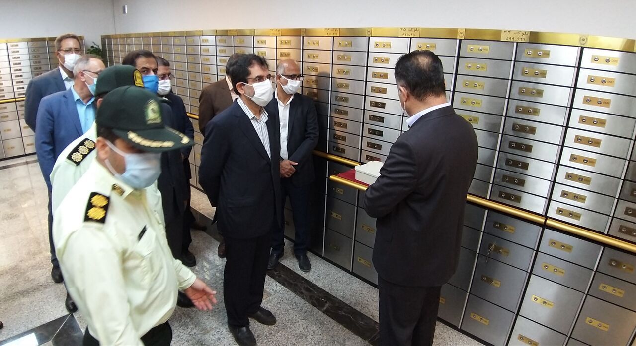 Officials and police inspect a section of safety deposit boxes at Bank Melli. June 6, 2022
