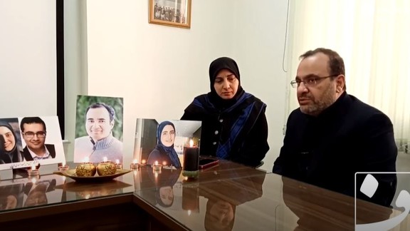 The Asadi-Lari family during a previous interview on January 2, with photos of their children.