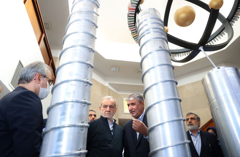 Iran's president Masoud Pezeshkian visiting a nuclear facility, accompanied by atomic agency chief Mohammad Eslami, Spring 2025