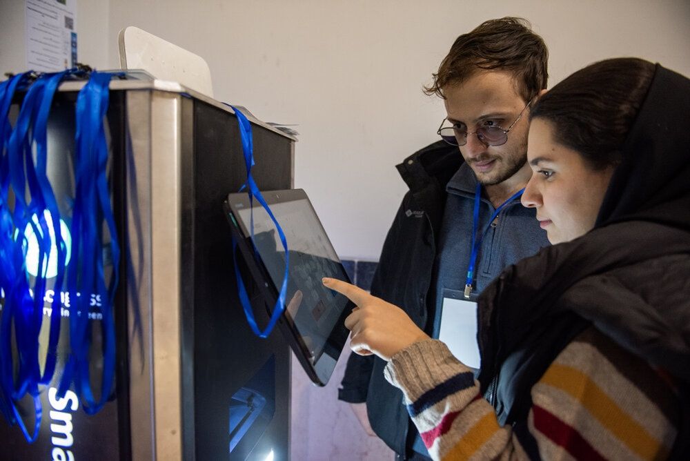 A man and woman attend the International Conference on Artificial Intelligence and Software Engineering in Shiraz, Iran, on November 24, 2024.