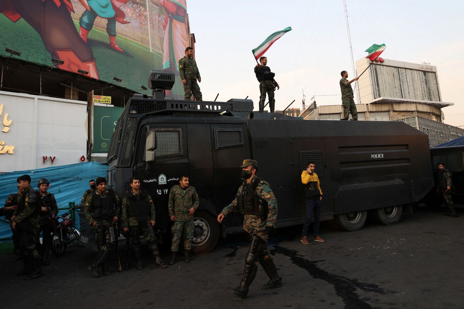 Forces of the Islamic Republic’s riot police celebrating on streets after Iran’s 2-0 victory against Wales on November 25, 2022  