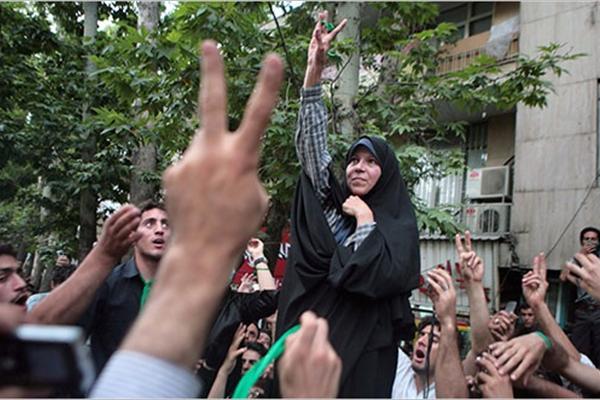 An undated photo of Faezeh Hashemi in 2010s among supporters.