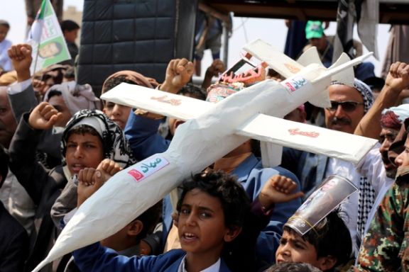 Followers of the Houthi movement carry a mock drone during a rally held to mark the Shiite Ashura day in Yemen. September 10, 2019.