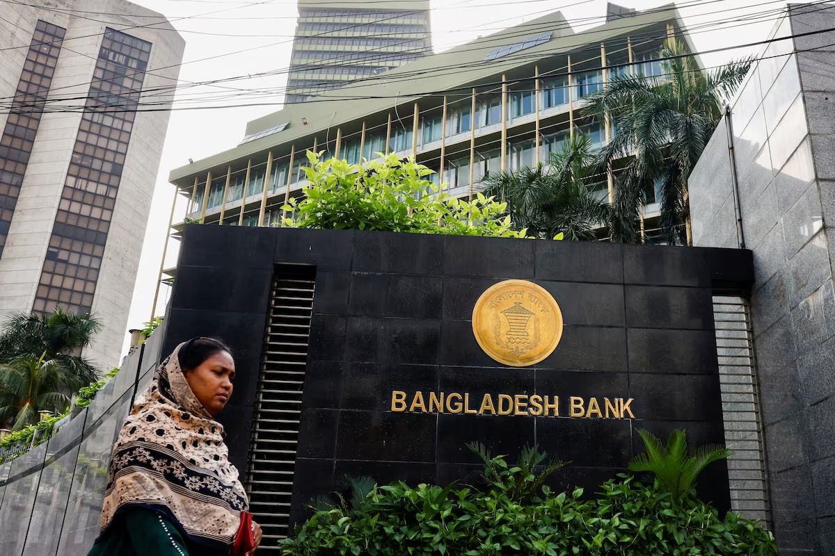 A woman passes by Bangladesh's central bank in Dhaka, Bangladesh, July 19, 2023. 