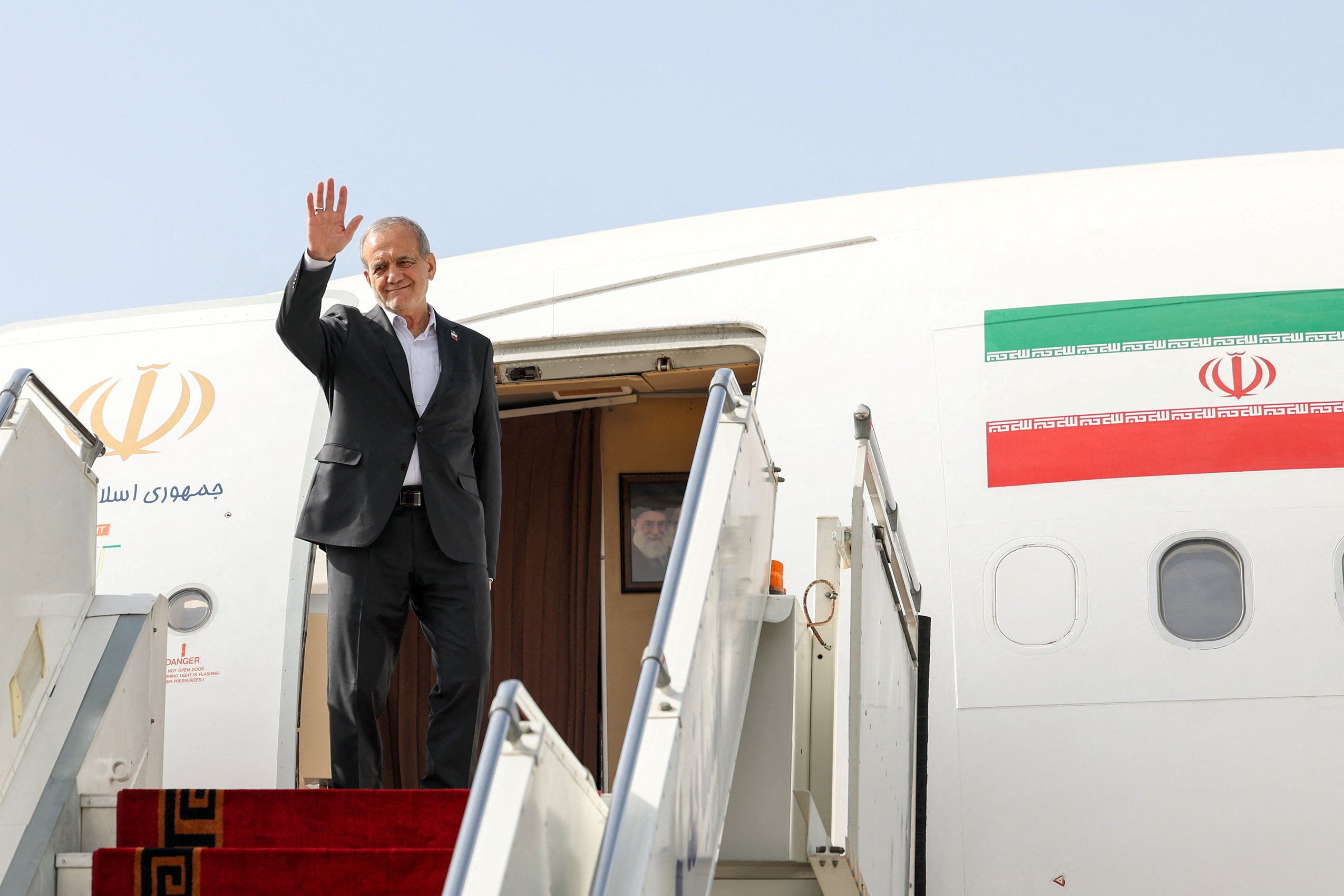 Iranian President Masoud Pezeshkian waves before departing for New York, at Mehrabad Airport in Tehran, Iran, September 23, 2025.