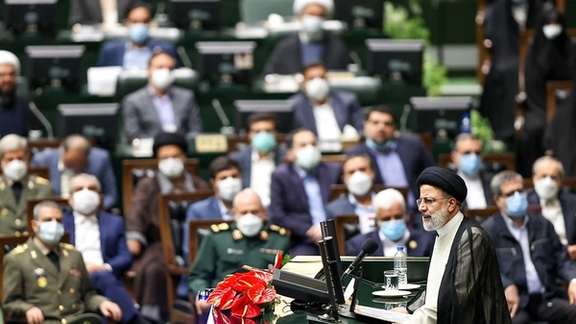 President Ebrahim Raisi delivering a speech to hardliner parliament in 2021