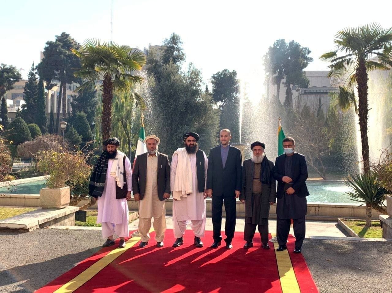 Iranian Foreign Minister Hossein Amir-Abdollahian (4th left) and his Afghani counterpart Amir Khan Muttaqi (3rd left) in Tehran  