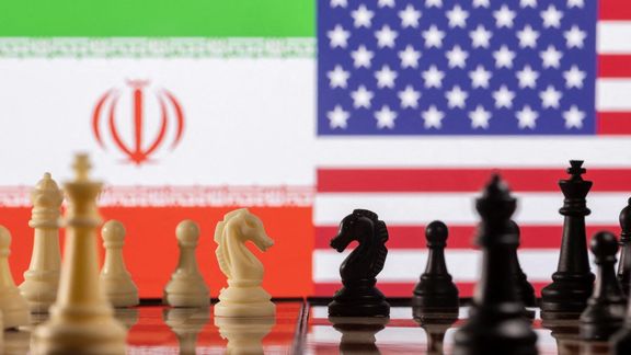 Chess pieces are seen in front of displayed Iran's and US flags in this illustration taken January 26, 2022.