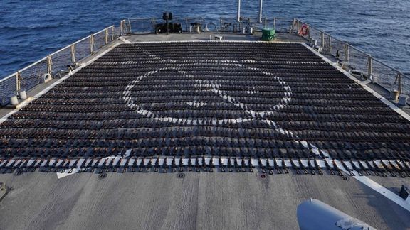 Thousands of AK-47 assault rifles sit on the flight deck of guided-missile destroyer USS The Sullivans (DDG 68) during an inventory process on January 7, 2023.