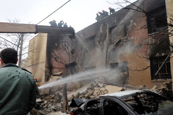 Firefighters battling a blaze after the crash of an F5 in Tabriz on Monday.