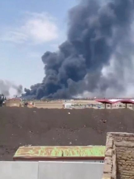 Smoke rises from Tabriz airport in Iran, June 13, 2025 in this screengrab obtained from a social media video.