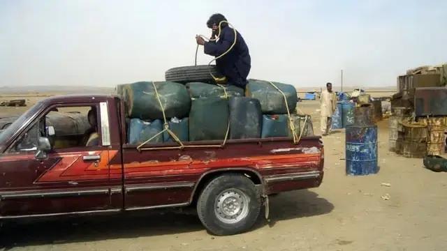 A pickup truck loaded with canisters of gasoline destined for Pakistan (Undated)