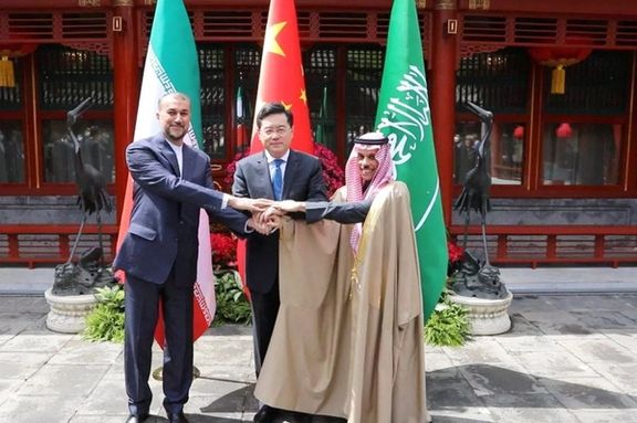 Iranian Foreign Minister Hossein Amir-Abdollahian and Saudi Arabia's Foreign Minister Prince Faisal bin Farhan Al Saud and Chinese Foreign Minister Qin Gang shake hands during a meeting in Beijing, April 6, 2023