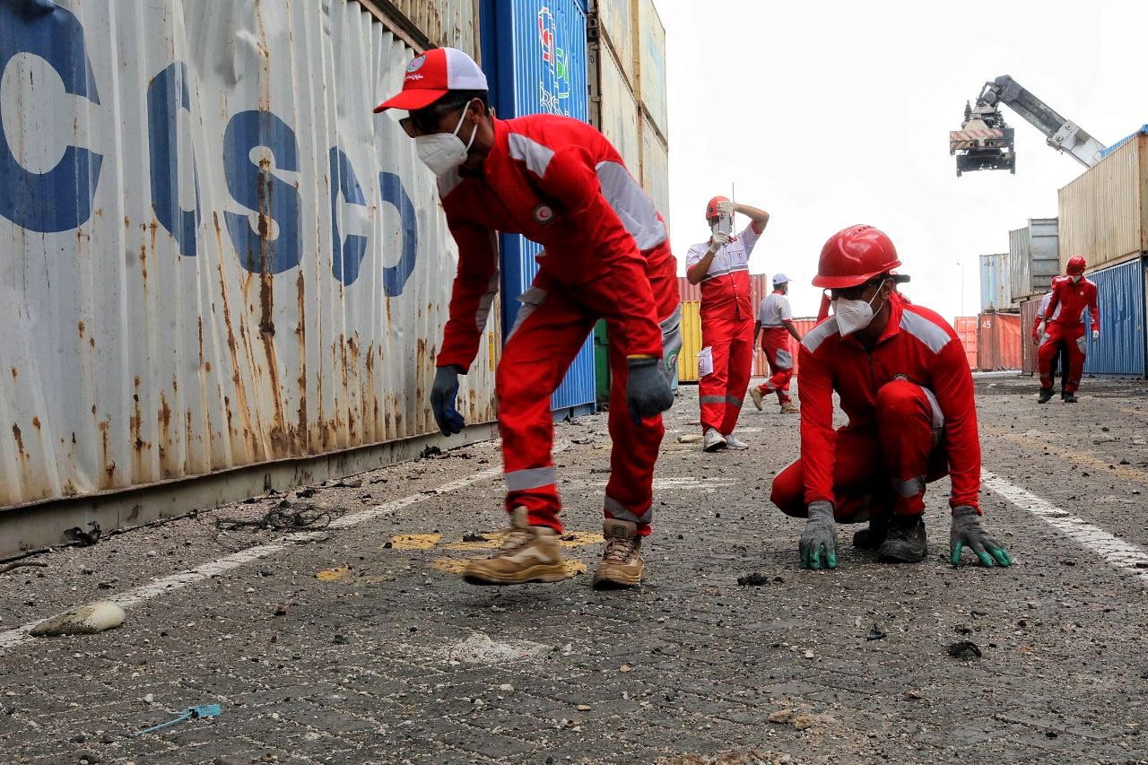 Iranian Red Crescent rescuers work following an explosion at the Shahid Rajaee port in Bandar Abbas, Iran, April 27, 2025.