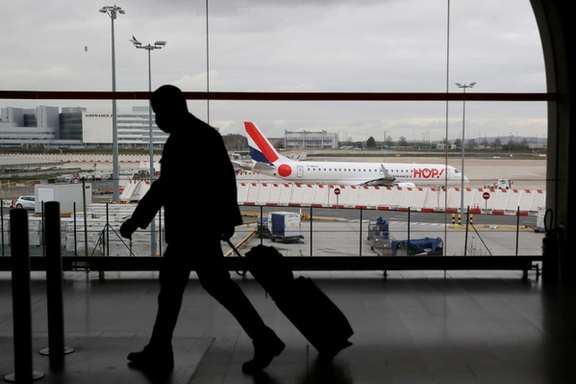 A man walks inside a Terminal at Paris Charles de Gaulle airport in Roissy near Paris, rance, February 5, 2021.
