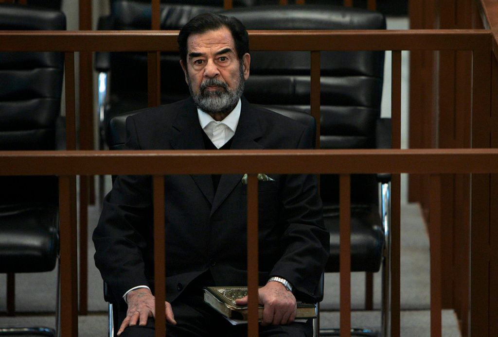Saddam Hussein sits in court during the continuation of his trail in Baghdad, December 6, 2006. 