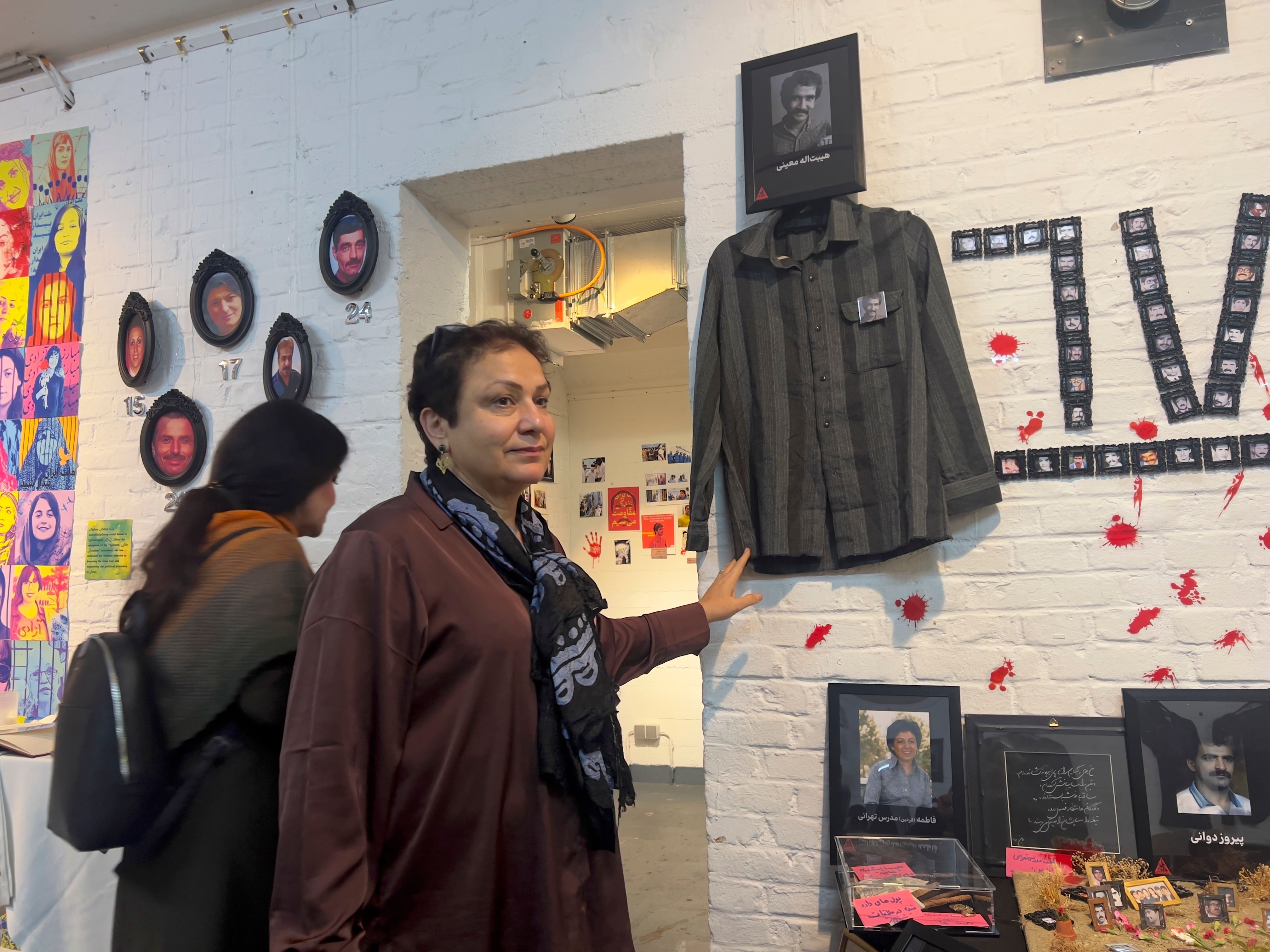 Khatereh Moini standing next to her brother's shirt