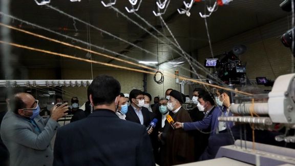 President Ebrahim Raisi visiting an idle textile factory in 2022