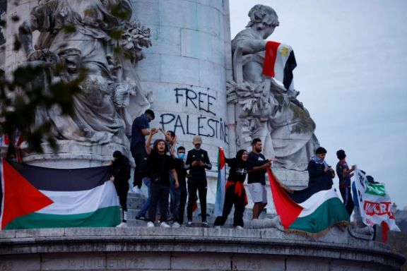 Protestors hold Palestinian flags during an unauthorized demonstration in support of Palestinians, as part of the ongoing conflict between Israel and the Palestinian Islamist group Hamas, at Place de la Republique in Paris on October 12, 2023.