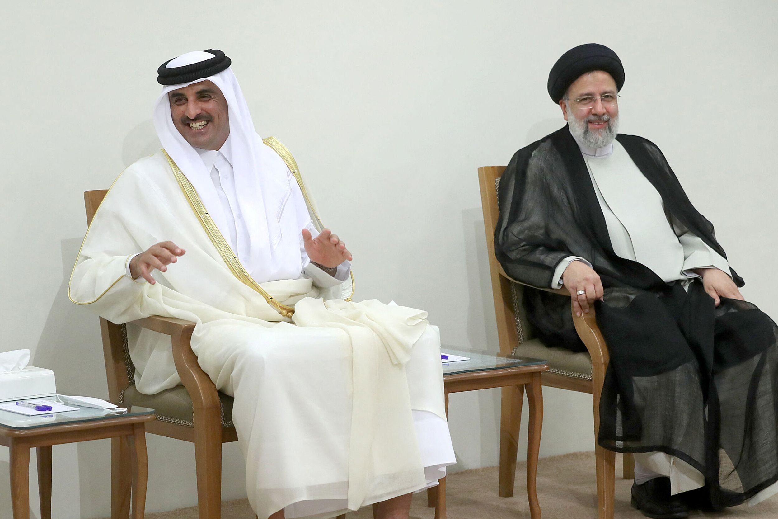 Qatar's Emir with the Iranian president during meeting with Khamenei. May 12, 2022