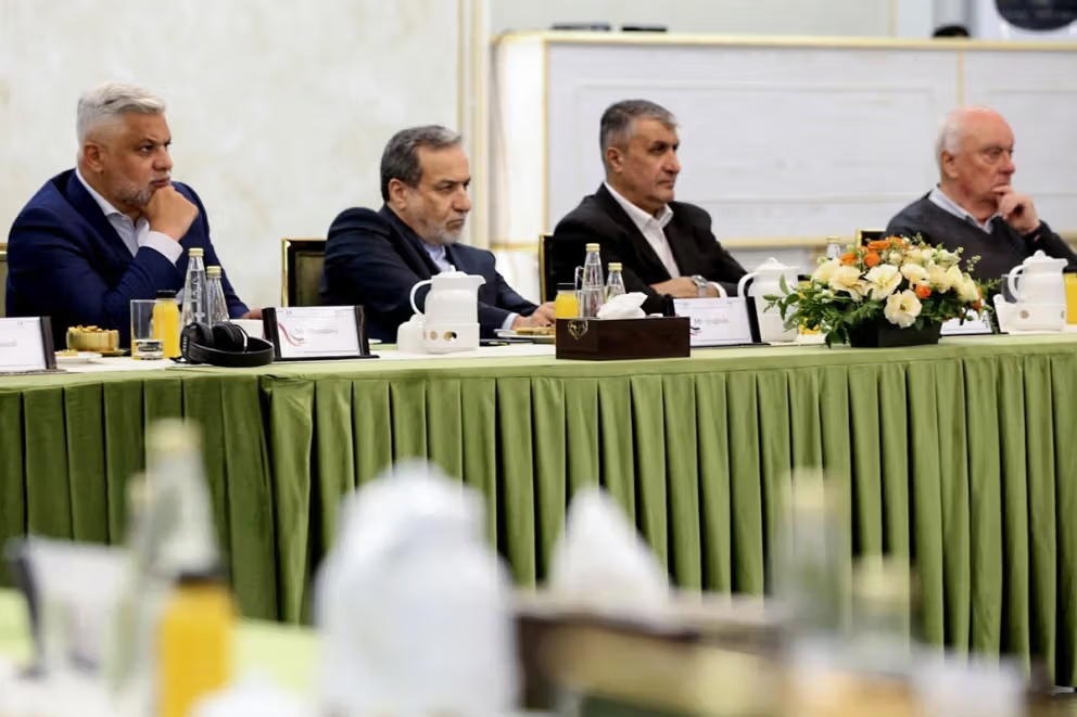 Iran's nuclear chief Mohammad Eslami (second from right) and Foreign Minister Abbas Araghchi (second from left)