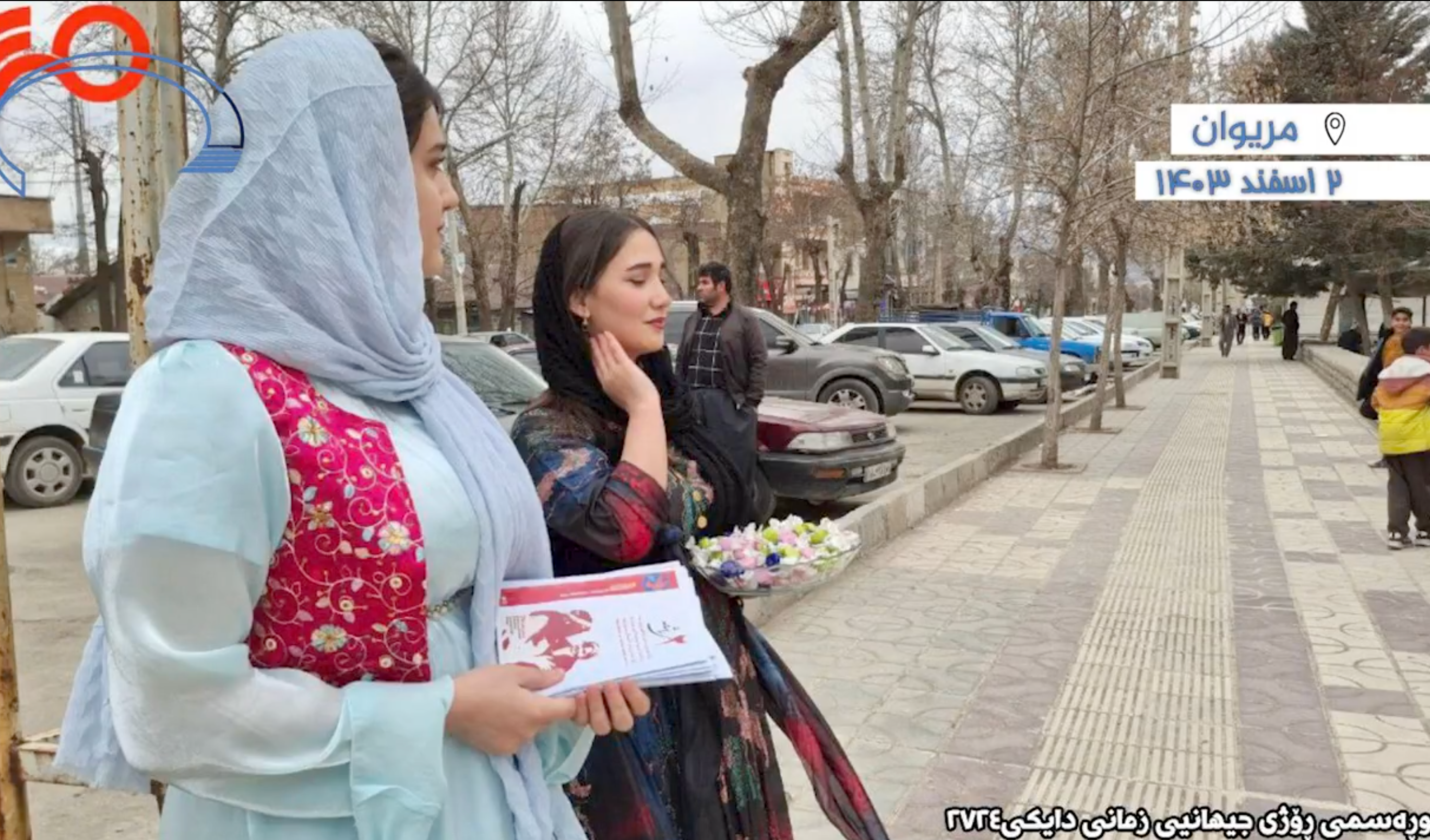Kurdish activists distributing leaflets on International Mother Language Day in Marivan, Iran