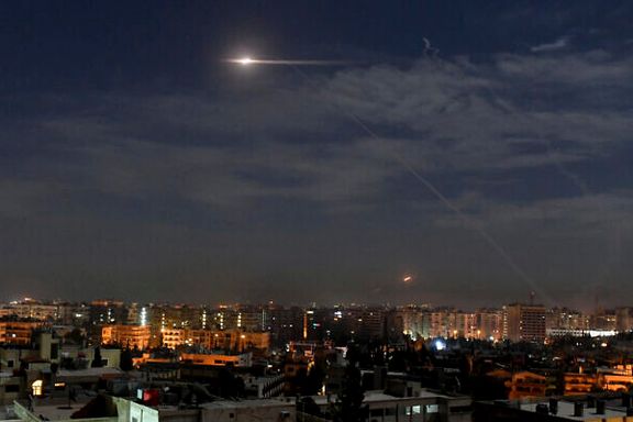 Lights are seen in the skies over Damascus during the air strike on June 14, 2023