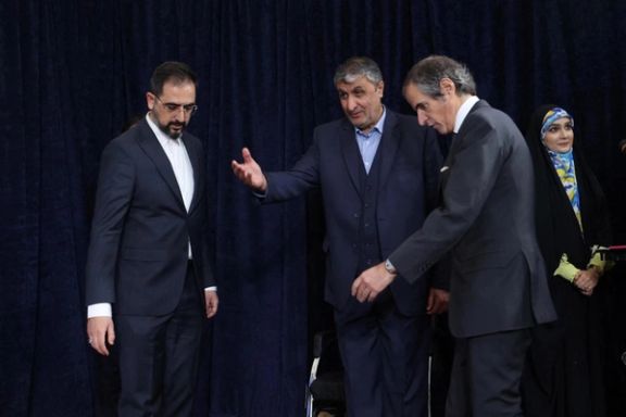 Head of Iran's Atomic Energy Organization Mohammad Eslami and International Atomic Energy Agency (IAEA) Director General Rafael Grossi arrive at a news conference, in Tehran, March 4, 2023