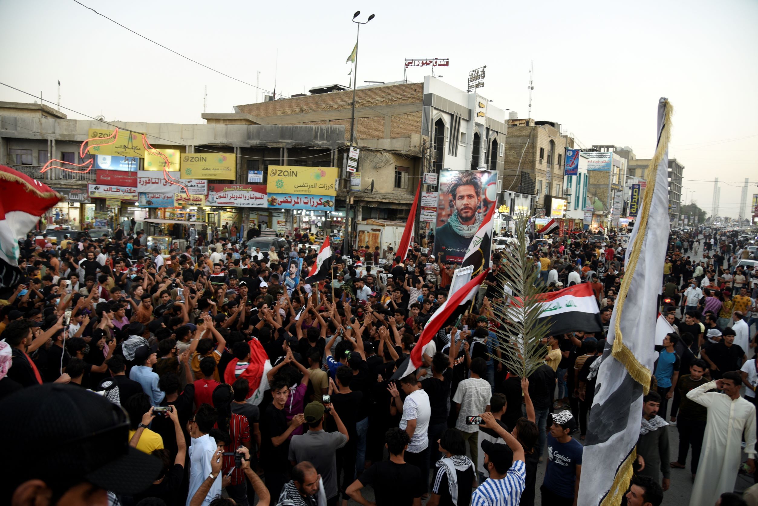 People supporting the Imtidad Movement celebrate after preliminary results of Iraq's parliamentary election were announced in in Nassiriya, Iraq October 11, 2021. 