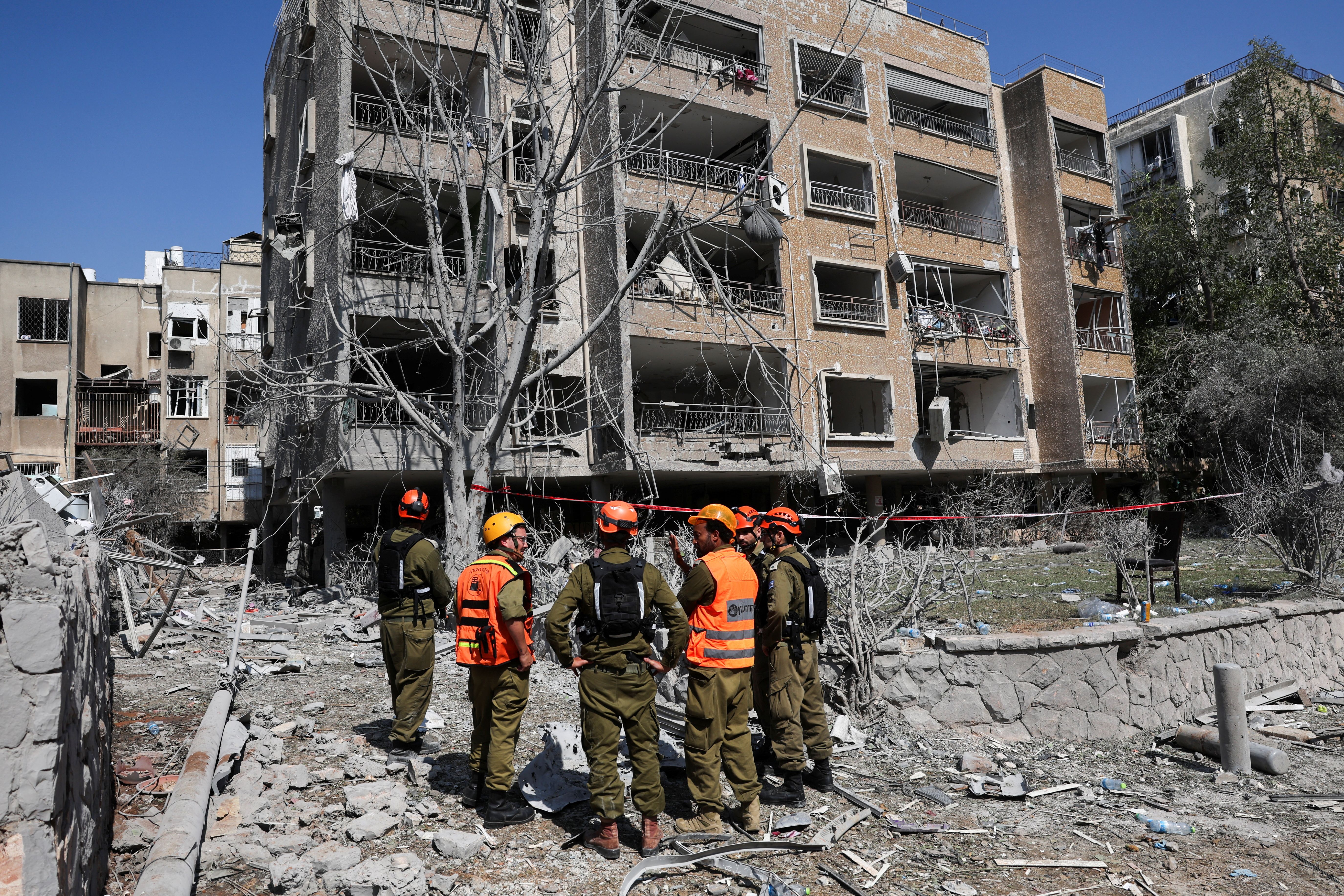 Rescue personnel work at an impact site following missile attack from Iran on Israel, in Ramat Gan, Israel, June 14, 2025.
