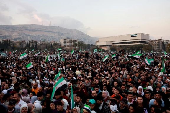 People gather during a celebration called by Hayat Tahrir al-Sham (HTS) at the Umayyad Square, after the ousting of Syria's Bashar al-Assad, in Damascus, Syria, December 20, 2024.