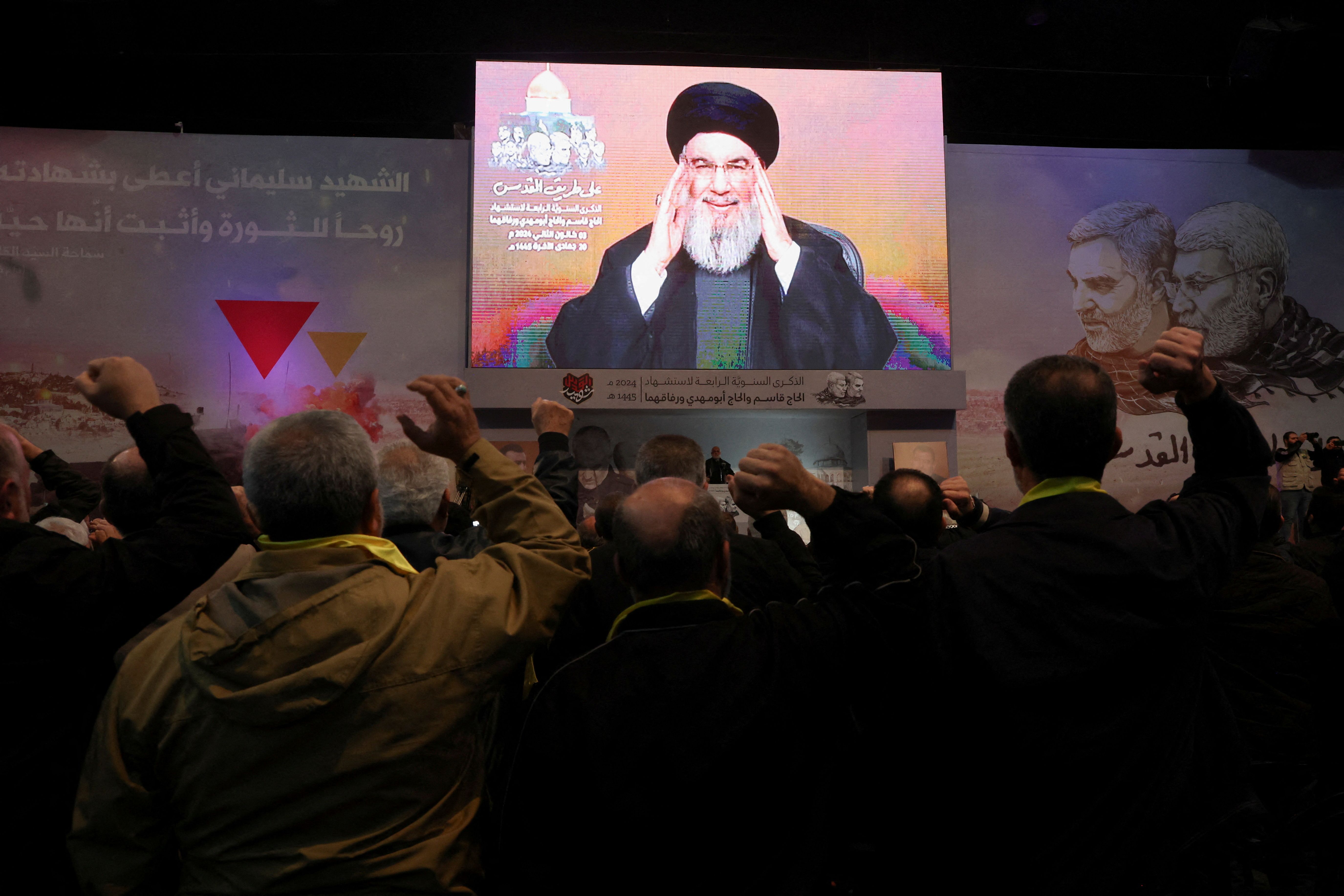 Lebanon's Hezbollah leader Sayyed Hassan Nasrallah addresses his supporters through a screen during a ceremony to mark the fourth anniversary of the killing of senior Iranian military commander General Qassem Soleimani in a US attack, in Beirut's southern suburbs, Lebanon January 3, 2024. 