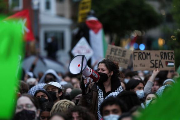 A protester uses a bullhorn as students and others demonstrate at a protest encampment at University Yard in support of Palestinians in Gaza, during the ongoing conflict between Israel and the Palestinian Islamist group Hamas, at George Washington University in Washington, April 25.