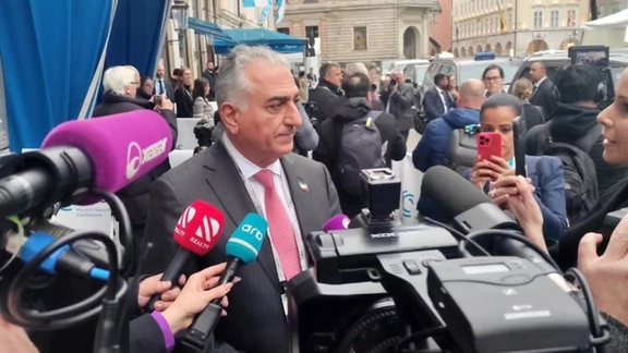 Prince Reza Pahlavi speaking to reporters on the sidelines of the Munich Security Conference