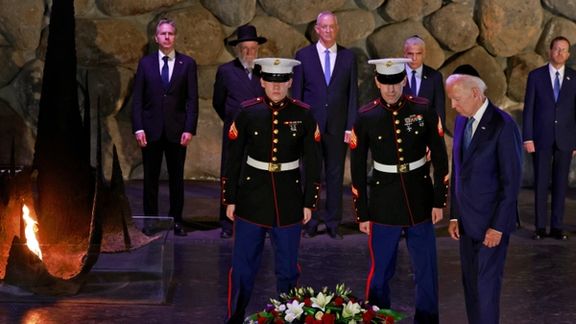 US President Joe Biden lays a wreath of flowers as Secretary of State Antony Blinken, Holocaust survivor and Chairman of the Yad Vashem Council Rabbi Israel Meir Lau, Israeli Defence Minister Benny Gantz, Israel's caretaker Prime Minister Yair Lapid and Israel's President Isaac Herzog look on at the Hall of Remembrance of the Yad Vashem Holocaust Memorial museum in Jerusalem, July 13, 2022.